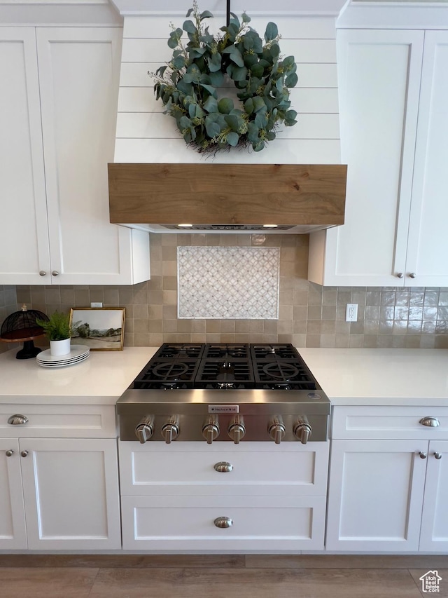 1491 N Starry Way Unit 218, Saratoga Springs, UT 84045 - kitchen with stainless steel gas cooktop, white cabinets, light countertops, and backsplash