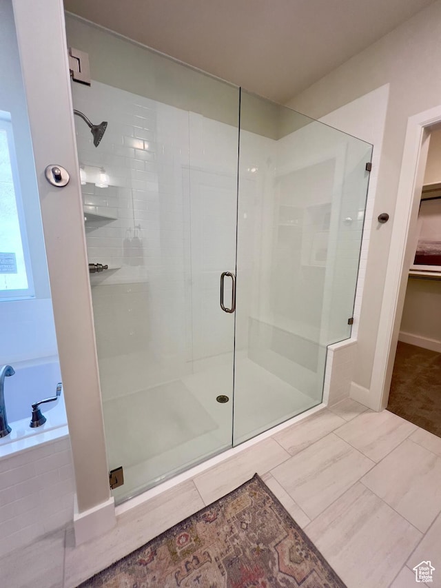 1491 N Starry Way Unit 218, Saratoga Springs, UT 84045 - full bathroom featuring a shower stall, a garden tub, and a spacious closet