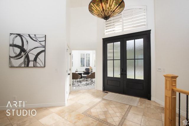14714 S Pristine Dr E, Draper, UT 84020 - entryway featuring baseboards, french doors, and a towering ceiling