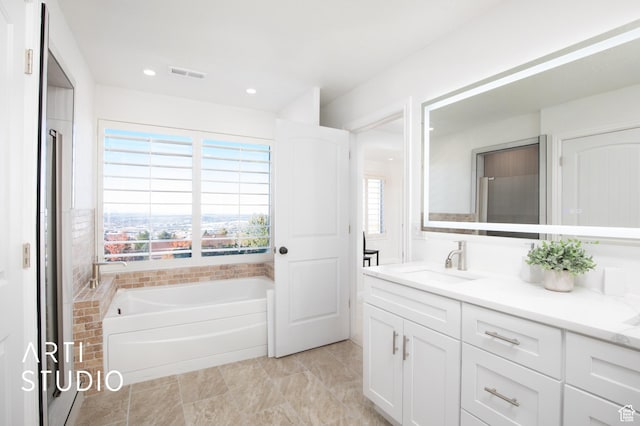 14714 S Pristine Dr E, Draper, UT 84020 - bathroom featuring recessed lighting, visible vents, a garden tub, and vanity