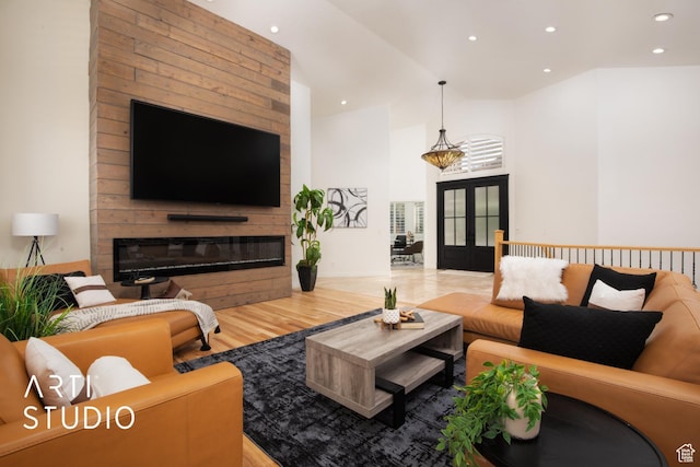 14714 S Pristine Dr E, Draper, UT 84020 - living room with a glass covered fireplace, french doors, recessed lighting, and wood finished floors
