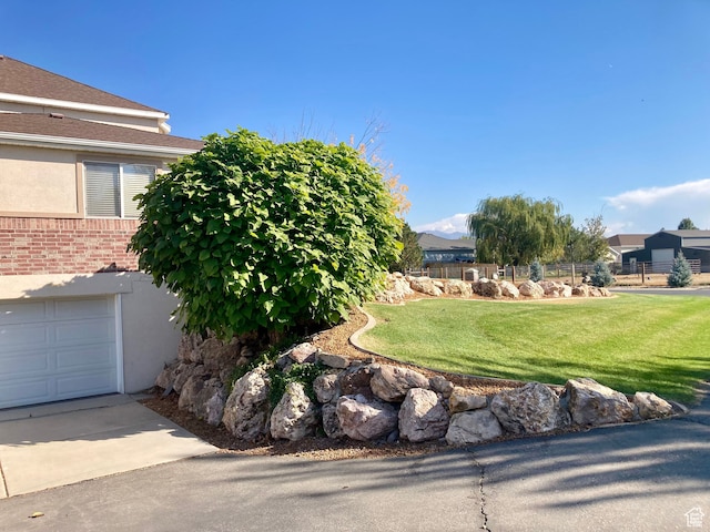 5046 W 4250 S, West Haven, UT 84401 - view of yard with a garage and fence
