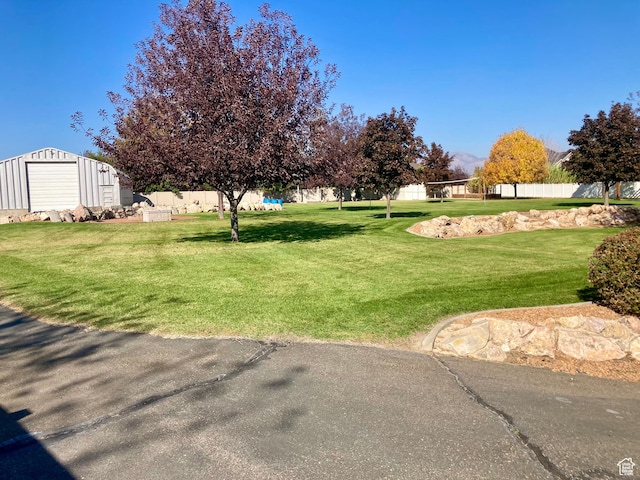 5046 W 4250 S, West Haven, UT 84401 - view of yard with an outdoor structure and fence