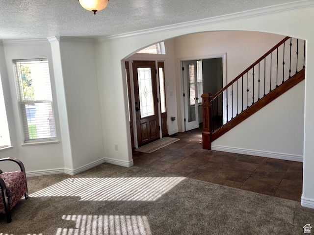 5046 W 4250 S, West Haven, UT 84401 - foyer featuring ornamental molding, arched walkways, and dark colored carpet
