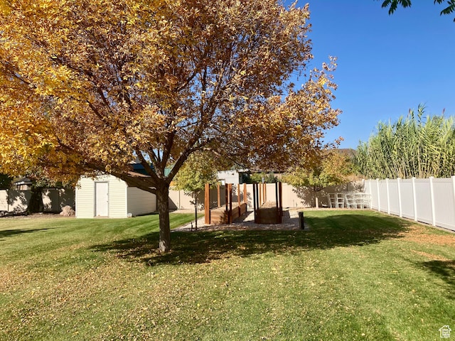 5046 W 4250 S, West Haven, UT 84401 - view of yard with an outdoor structure, fence, and a storage shed
