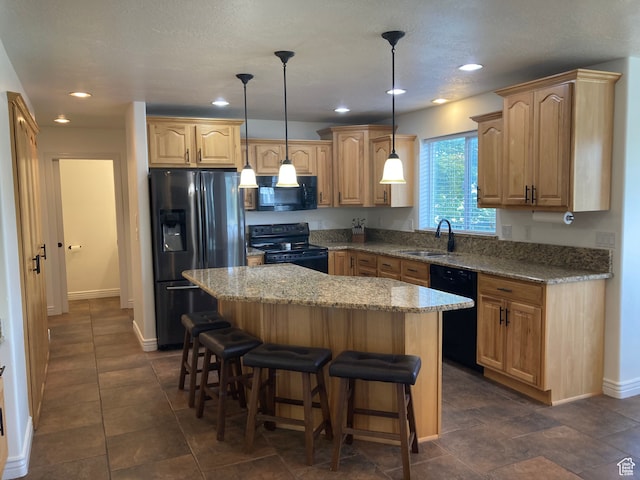 5046 W 4250 S, West Haven, UT 84401 - kitchen featuring a sink, a kitchen island, light stone countertops, black appliances, and decorative light fixtures