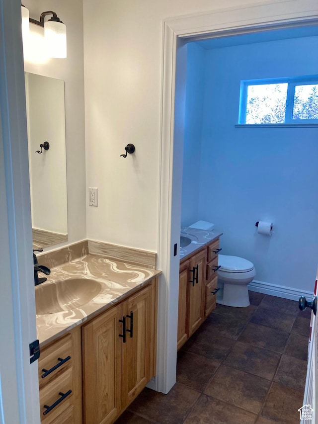 5046 W 4250 S, West Haven, UT 84401 - bathroom with toilet, baseboards, and vanity