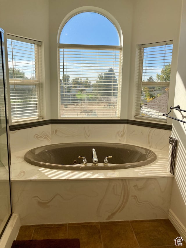 5046 W 4250 S, West Haven, UT 84401 - bathroom featuring a bath, a wealth of natural light, and tile patterned floors