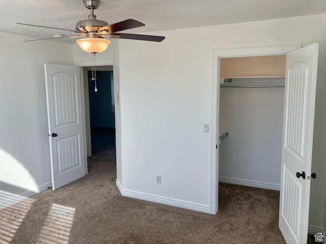 5046 W 4250 S, West Haven, UT 84401 - unfurnished bedroom with a closet, dark carpet, a spacious closet, a textured ceiling, and baseboards