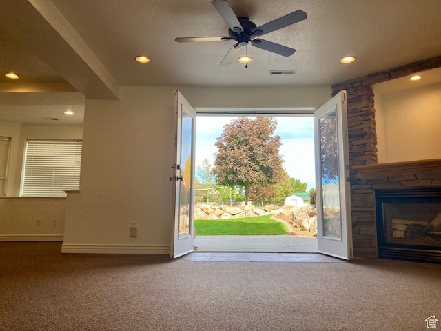 5046 W 4250 S, West Haven, UT 84401 - interior space featuring a textured ceiling, recessed lighting, a fireplace, visible vents, and carpet