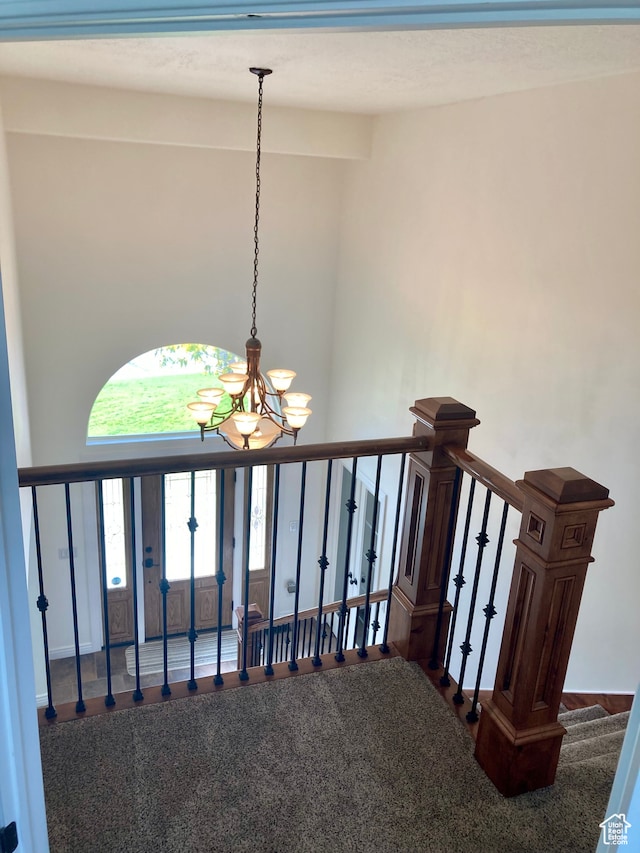 5046 W 4250 S, West Haven, UT 84401 - stairway featuring a notable chandelier and a towering ceiling