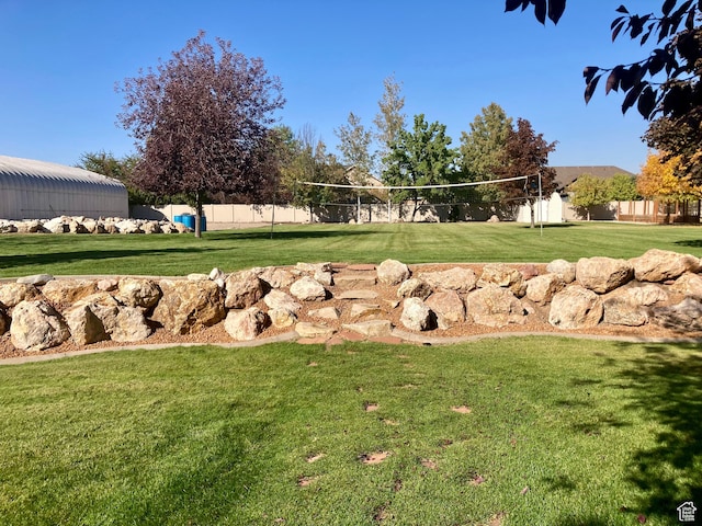 5046 W 4250 S, West Haven, UT 84401 - view of community with a lawn, volleyball court, and fence