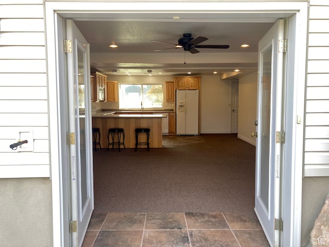 5046 W 4250 S, West Haven, UT 84401 - interior space featuring dark colored carpet, stone finish flooring, baseboards, and recessed lighting
