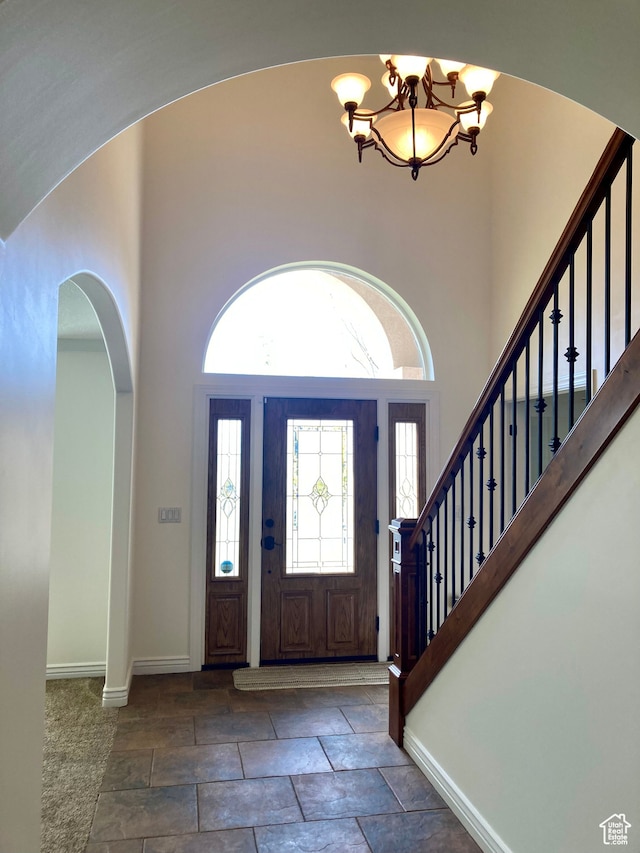 5046 W 4250 S, West Haven, UT 84401 - foyer with baseboards, a high ceiling, stairway, and a notable chandelier