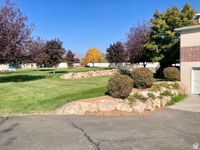 5046 W 4250 S, West Haven, UT 84401 - view of property's community with a lawn and fence