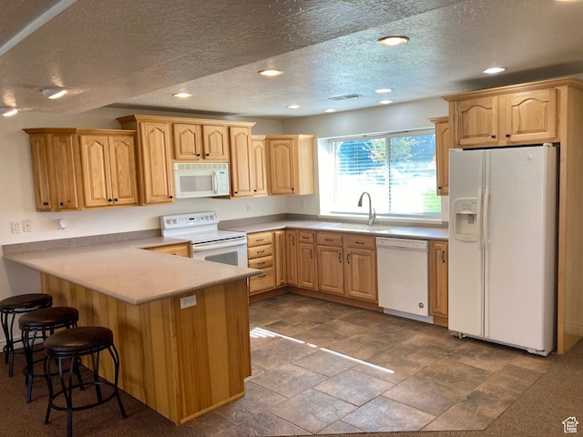 5046 W 4250 S, West Haven, UT 84401 - kitchen with light countertops, visible vents, a sink, white appliances, and a peninsula