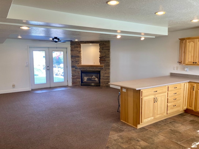 5046 W 4250 S, West Haven, UT 84401 - kitchen featuring dark colored carpet, light countertops, open floor plan, a textured ceiling, and a peninsula