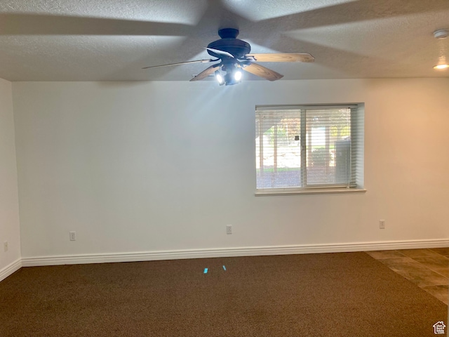 5046 W 4250 S, West Haven, UT 84401 - empty room with ceiling fan, baseboards, dark colored carpet, and a textured ceiling