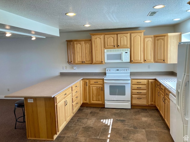 5046 W 4250 S, West Haven, UT 84401 - kitchen with visible vents, light countertops, white appliances, a peninsula, and a kitchen breakfast bar