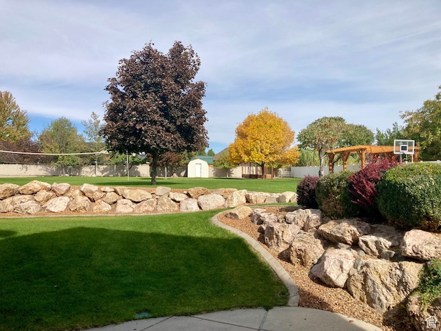 5046 W 4250 S, West Haven, UT 84401 - view of property's community featuring an outbuilding, a yard, a shed, and fence