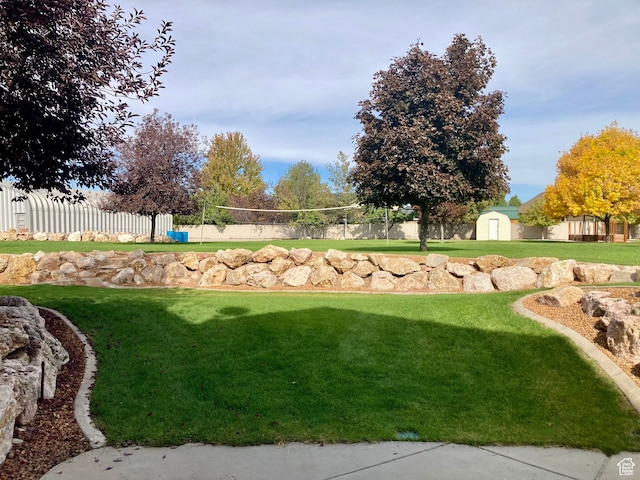 5046 W 4250 S, West Haven, UT 84401 - view of yard with an outbuilding, fence, volleyball court, and a storage unit
