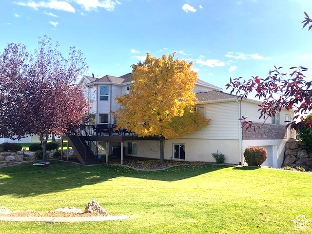 5046 W 4250 S, West Haven, UT 84401 - back of house featuring a wooden deck, stairway, and a yard