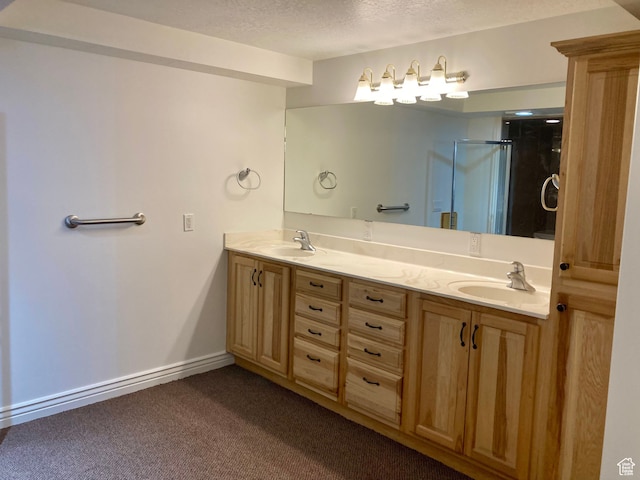 5046 W 4250 S, West Haven, UT 84401 - bathroom featuring double vanity, a shower stall, a textured ceiling, and a sink