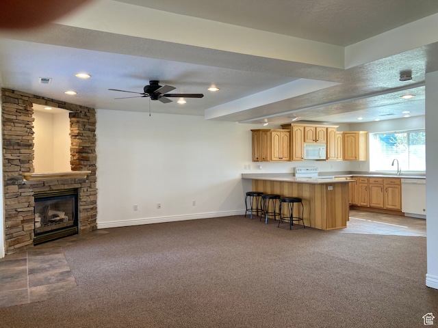 5046 W 4250 S, West Haven, UT 84401 - kitchen with a peninsula, white appliances, a breakfast bar, open floor plan, and light countertops