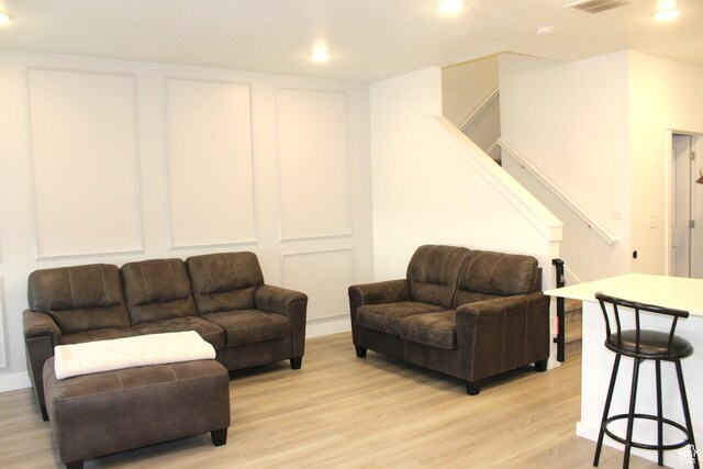 953 N 900 W, Tremonton, UT 84337 - living room featuring light wood finished floors, visible vents, recessed lighting, and stairs