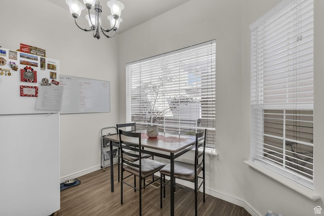 83 N 380 W, Orem, UT 84057 - dining room featuring wood finished floors, baseboards, a notable chandelier, and plenty of natural light