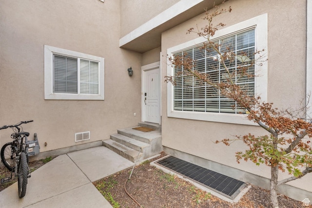 83 N 380 W, Orem, UT 84057 - entrance to property with stucco siding, visible vents, and a patio