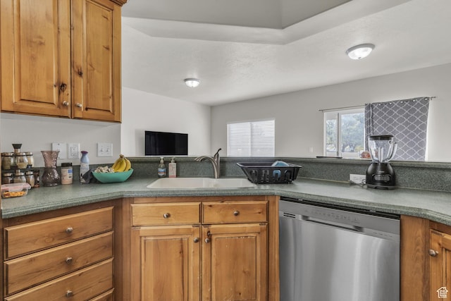 83 N 380 W, Orem, UT 84057 - kitchen featuring brown cabinetry, stainless steel dishwasher, a sink, and dark countertops