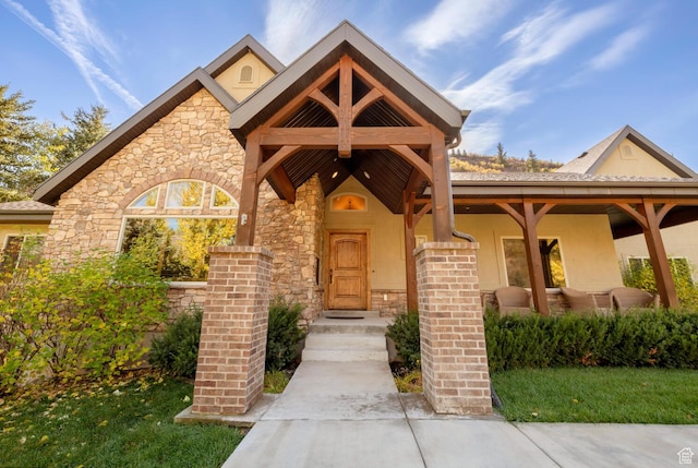 10569 S Covered Bridge Dr, Spanish Fork, UT 84660 - view of front of home featuring stone siding and stucco siding