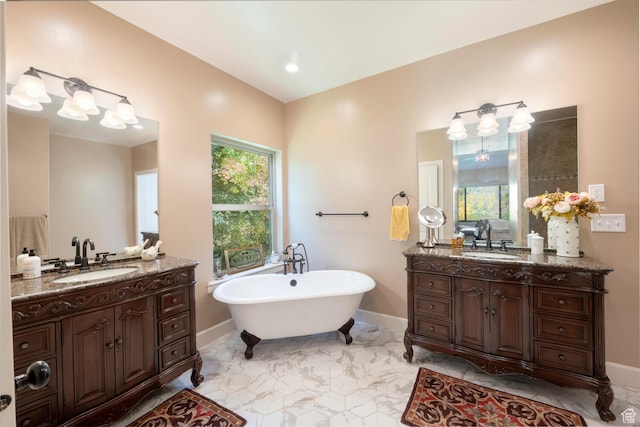10569 S Covered Bridge Dr, Spanish Fork, UT 84660 - full bathroom featuring a freestanding bath, baseboards, two vanities, and marble finish floors
