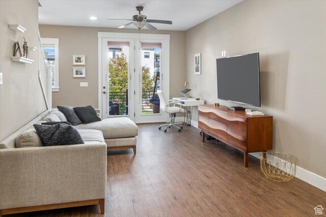 317 E Park Blvd, Ogden, UT 84401 - living room with baseboards, ceiling fan, wood finished floors, and a wealth of natural light