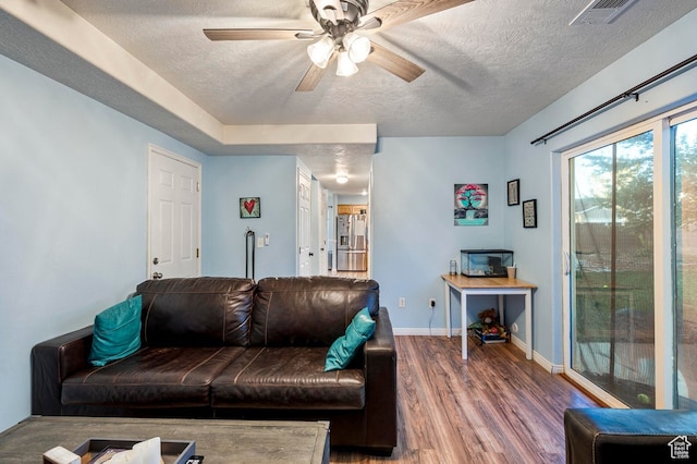 2668 N 550 W, Cedar City, UT 84721 - living room featuring a textured ceiling, hardwood / wood-style flooring, and ceiling fan