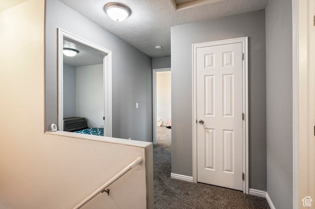 2668 N 550 W, Cedar City, UT 84721 - hallway featuring dark carpet and a textured ceiling