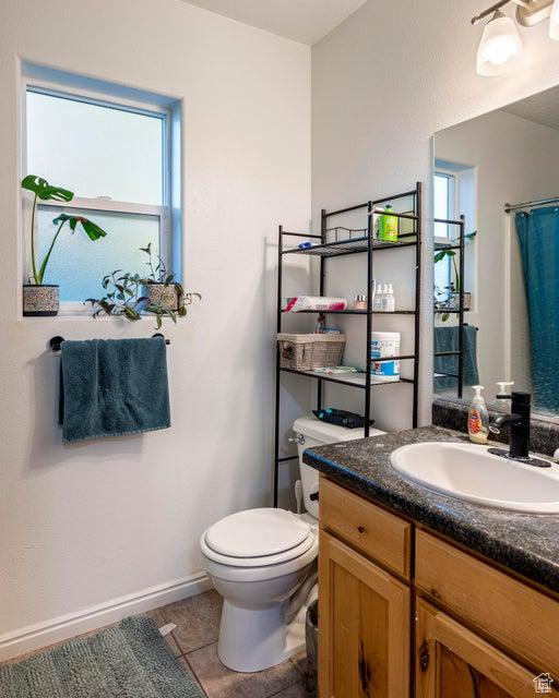 2668 N 550 W, Cedar City, UT 84721 - full bathroom featuring toilet, vanity, tile patterned floors, and baseboards