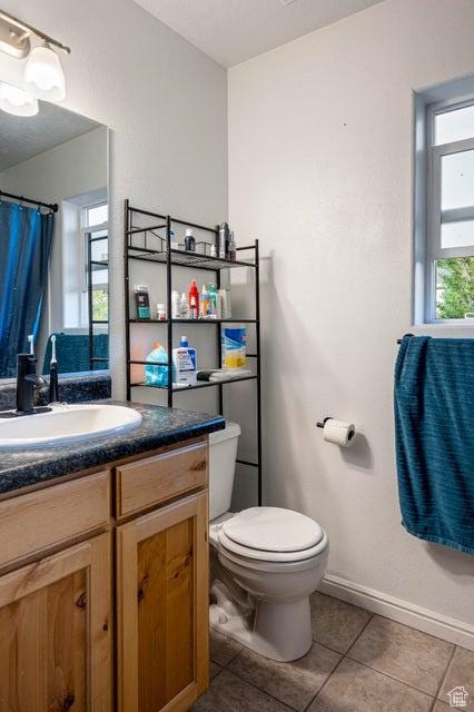 2668 N 550 W, Cedar City, UT 84721 - bathroom featuring tile patterned flooring, vanity, toilet, and baseboards