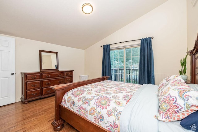 325 E 100 N, Willard, UT 84340 - bedroom with vaulted ceiling, light wood-style floors, and access to exterior