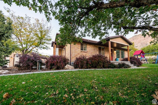 325 E 100 N, Willard, UT 84340 - ranch-style house featuring a front yard, brick siding, and a playground