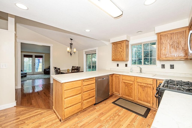 325 E 100 N, Willard, UT 84340 - kitchen with dishwasher, a sink, a peninsula, light wood-type flooring, and vaulted ceiling