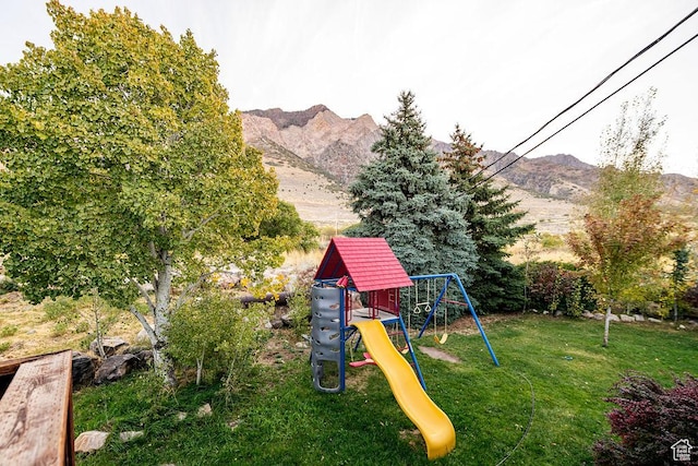 325 E 100 N, Willard, UT 84340 - view of grassy yard with a playground and a mountain view