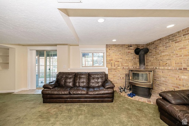 325 E 100 N, Willard, UT 84340 - living area featuring a textured ceiling, a wood stove, carpet floors, baseboards, and recessed lighting