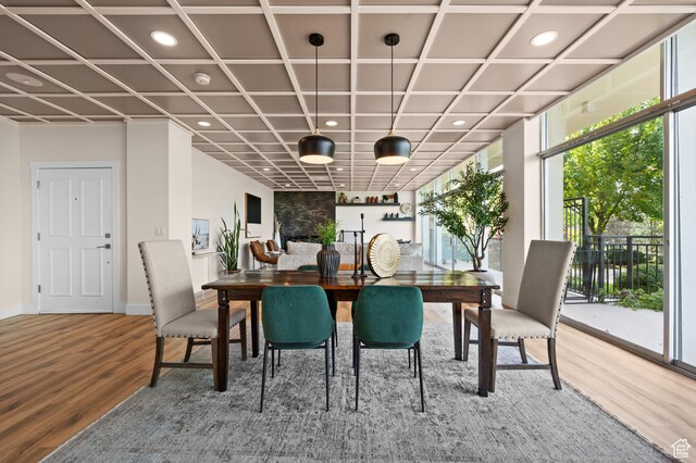 875 S Donner Way E Unit 111, Salt Lake City, UT 84108 - dining space featuring recessed lighting, a wealth of natural light, and wood finished floors