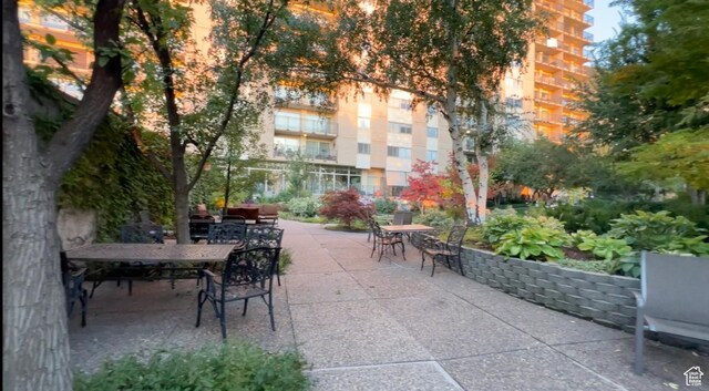 875 S Donner Way E Unit 111, Salt Lake City, UT 84108 - surrounding community with outdoor dining space and a patio area