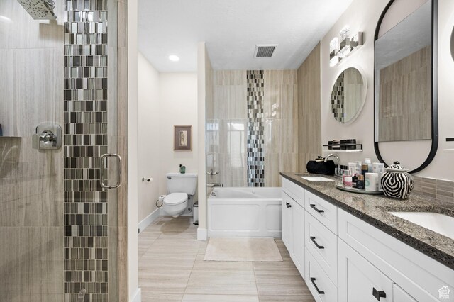 875 S Donner Way E Unit 111, Salt Lake City, UT 84108 - bathroom featuring visible vents, toilet, tiled shower, and a sink