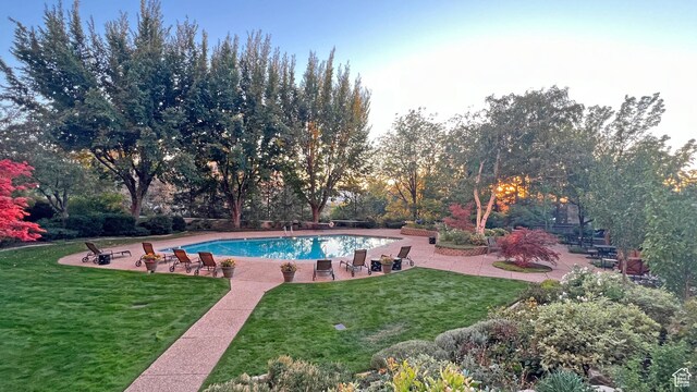 875 S Donner Way E Unit 111, Salt Lake City, UT 84108 - pool featuring a lawn and a patio