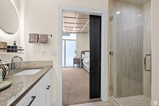 875 S Donner Way E Unit 111, Salt Lake City, UT 84108 - ensuite bathroom featuring a shower stall, vanity, and ensuite bath