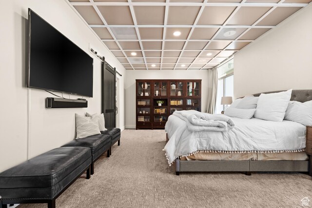 875 S Donner Way E Unit 111, Salt Lake City, UT 84108 - bedroom with a barn door, coffered ceiling, light colored carpet, and recessed lighting